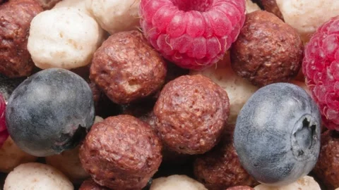 Dry breakfast. Corn balls with fresh berries close-up. Chocolate and milk grit Stockbeeldmateriaal 140930933