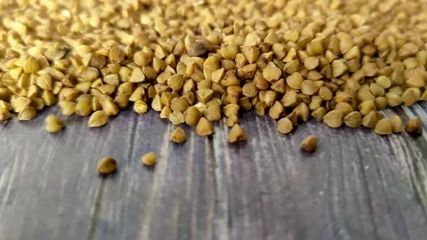 Dry buckwheat on a wooden table Stock Footage 231594080