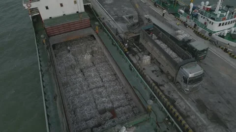 A Dry Cargo Ship With Bales Using A mobile crane Stock Footage 296596130