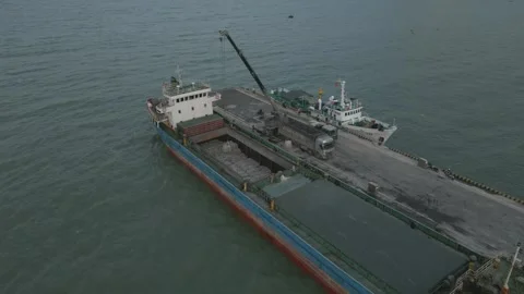 A Dry Cargo Ship With Bales Using A mobile crane Stock Footage 296596340