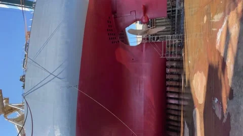 Dry-cargo ship in dry dock for repairs and maintenance at a shipyard. Stock Footage 201964341
