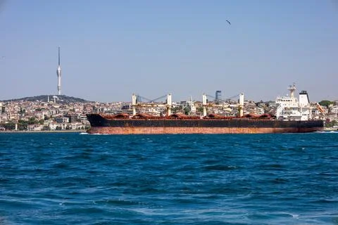 A dry cargo ship passing through the Bosphorus and aml?ca TV tower Stock Photos