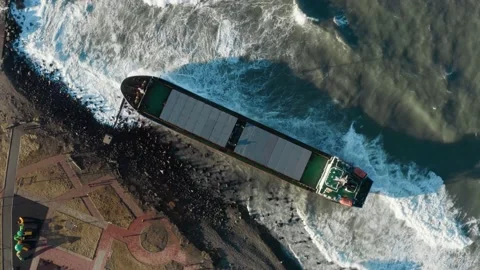 The dry cargo ship washed ashore during a sea storm. Oil spills. Stock Footage 170744200