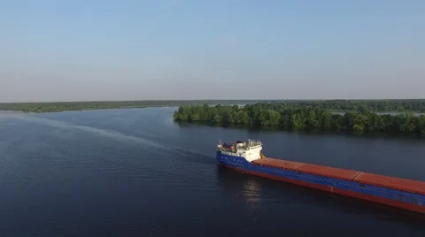 Dry cargo transport ship on the river at dawn. Aerial view. Stock-Footage 66330136