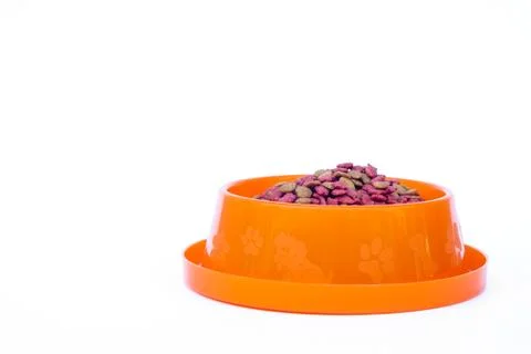 Dry cat food in orange bowl isolated on white background Stock Photos