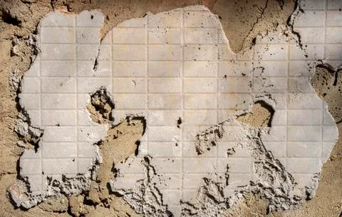 Dry cement texture with the pattern of a broken tile. Under construction Stock Photos