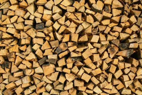 Dry chopped firewood logs ready for winter. Stock Photos