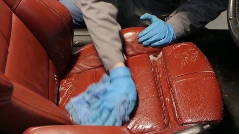 Dry cleaning of a cabriolet .Master cleans car seats. Stock Footage 76356041