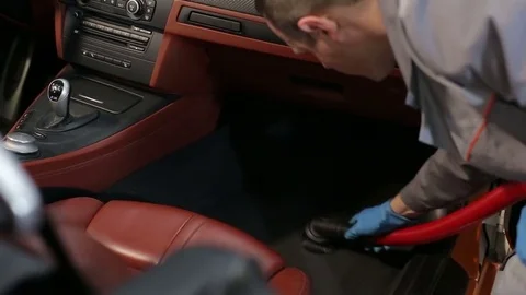 Dry cleaning of a cabriolet .The Master vacuum cleaner car interior.Two shot Stock Footage 76353097
