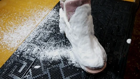 Dry cleaning shoes when using steam Stock Footage 123672395