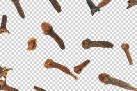 Dry clove buds falling creating a spice background Stock Photos