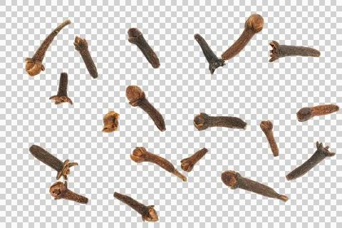 Dry clove buds falling creating a spice background Stock Photos