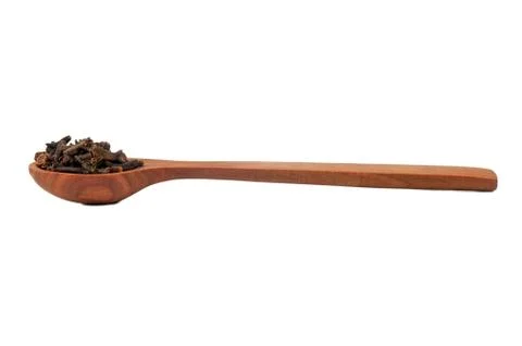 Dry cloves in spoon Stock Photos
