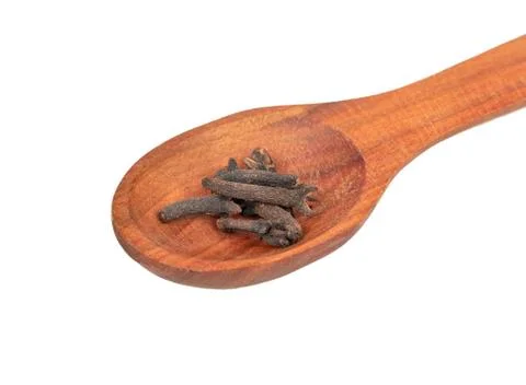 Dry cloves in spoon Stock Photos