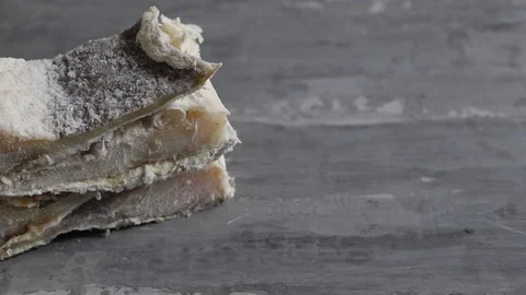 Dry cod fish on ceramic background Stock Footage 127976905