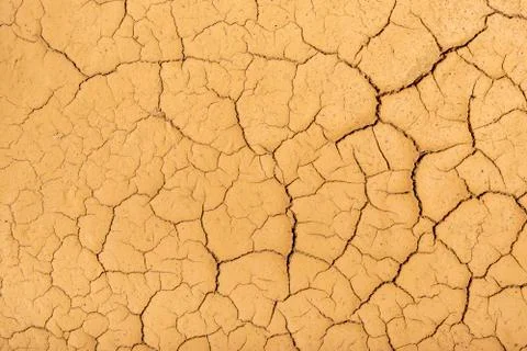 Dry cracked clay texture. Consequences of global warming. Climate change Фото