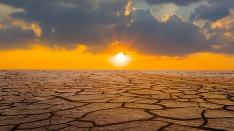 Dry cracked earth at the dramatic sunset time lapse scene Stock Footage 101601072