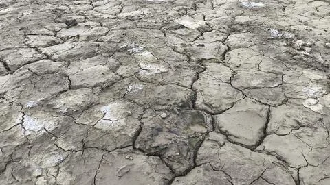 Dry Cracked Earth Texture Representing Drought and Climate Change Stock Photos