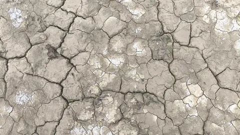 Dry Cracked Earth Texture Representing Drought and Climate Change Stock Photos