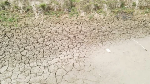 Dry cracked ground soil, desertification process caused by climate change, Stock Footage 236984200