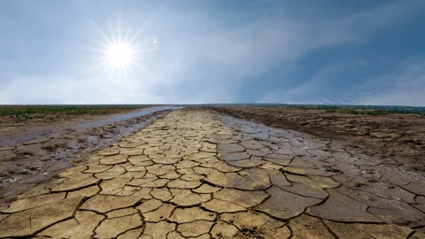 Dry cracked plain under sparkle hot sun time lapse scene Stock Footage 248039132