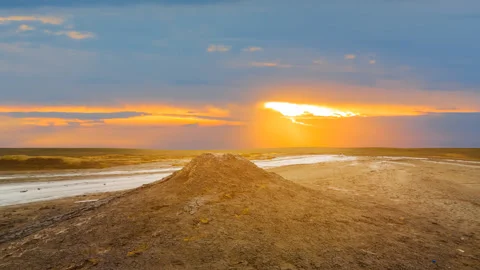 Dry cracked saline land at the dramatic sunset Stock Footage 313932622