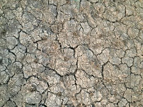 Dry cracked soil background with abstract geometric pattern. Stock Photos