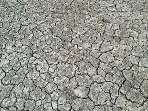 Dry cracked soil background with abstract geometric pattern. Stock Photos