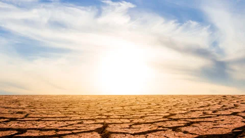 Dry cracked waterless plain at the sunset Stock Footage 345116576