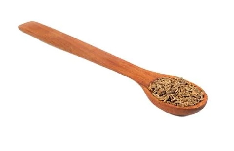 Dry cumin in spoon Stock Photos