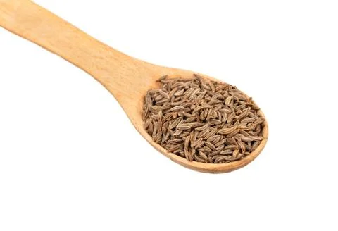 Dry cumin in spoon Stock Photos