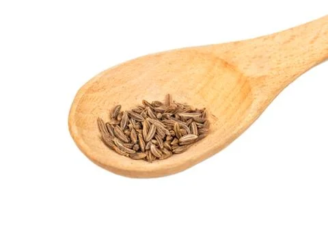 Dry cumin in spoon Stock Photos