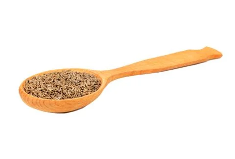 Dry cumin in spoon Stock Photos