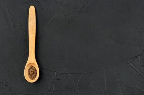 Dry cumin in spoon Stock Photos