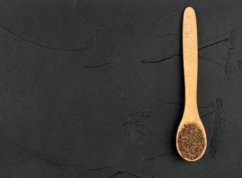 Dry cumin in spoon Stock Photos