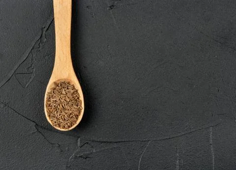 Dry cumin in spoon Stock-Fotos