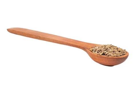 Dry cumin in spoon Stock Photos