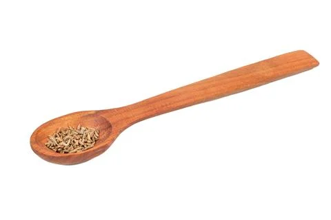 Dry cumin in spoon Stock Photos
