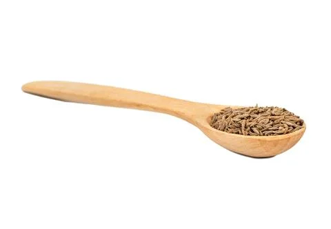 Dry cumin in spoon Stock Photos