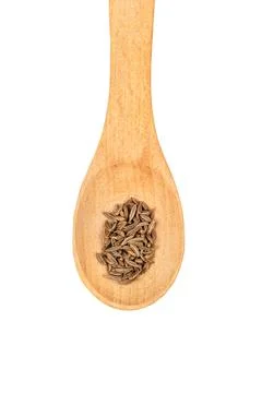 Dry cumin in spoon Stock Photos