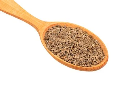 Dry cumin in spoon Stock Photos
