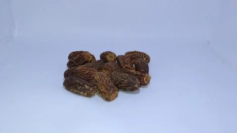 Dry date fruit close up picture with white background. Stock Photos