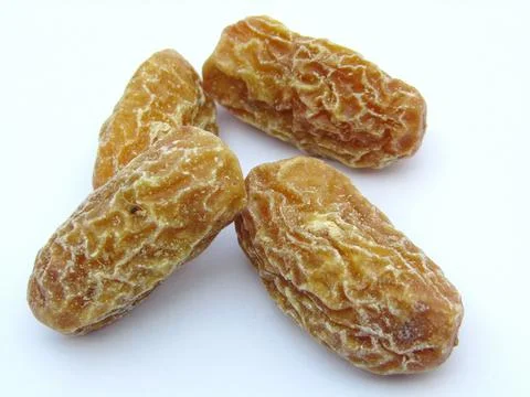 Dry dates ON white background close-up view  Stock Photos