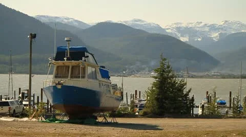 Dry docked boat by ocean Stock Footage 10751014
