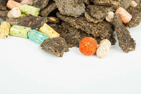 Dry feed for fish. Stock Photos