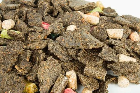 Dry feed for fish. Stock Photos