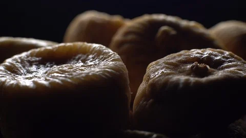 Dry figs. Close-up.  Pile of dried fruits in rotation on black background. Stock Footage 100710524
