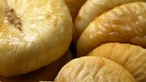 Dry figs in rotation on black background. Stock Footage 99558704