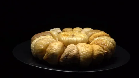 Dry figs in rotation on black background. Stock Footage 99559284
