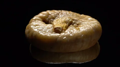 Dry figs in rotation on black background. Stock Footage 99583349